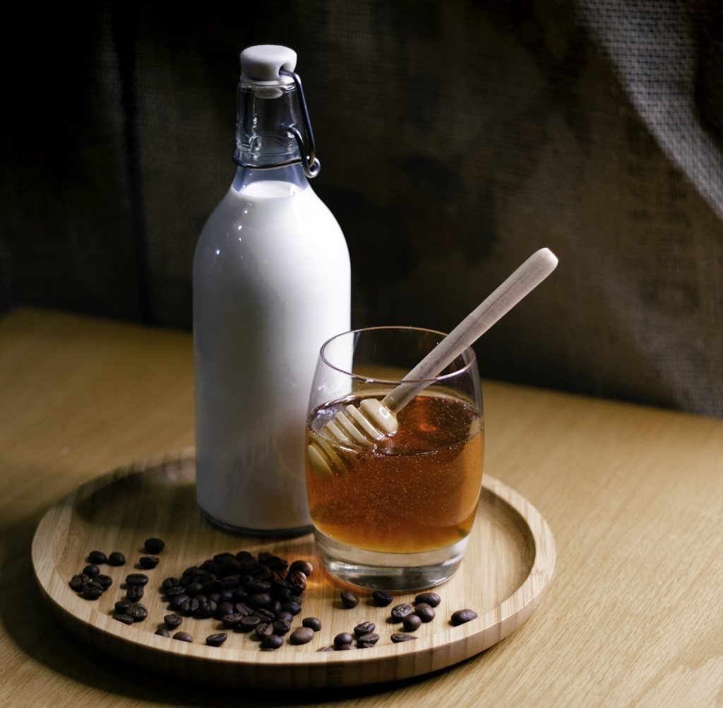 Milk And Honey On Wooden Tray